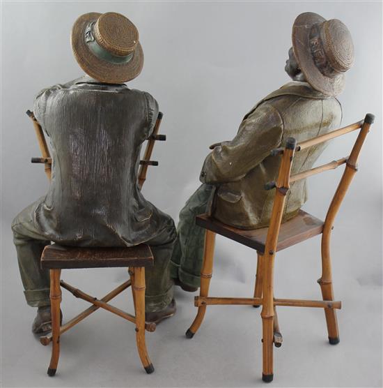 A pair of Johann Maresch Austrian painted terracotta figures, largest 18in., some damages